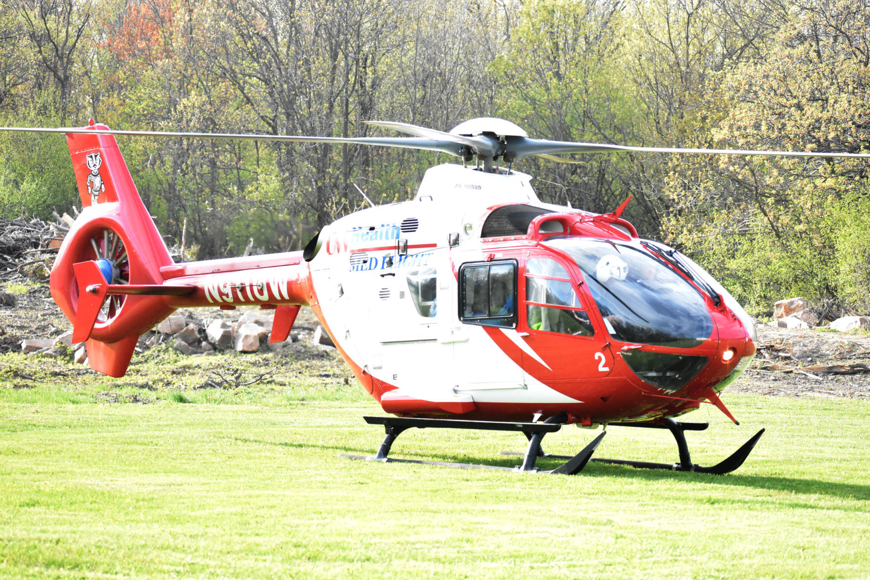 Med Flight chopper lands in a field
